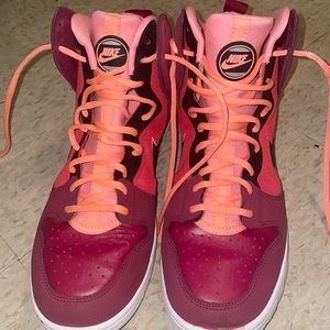 Some red and kinda orange shoes they are a size 8.5